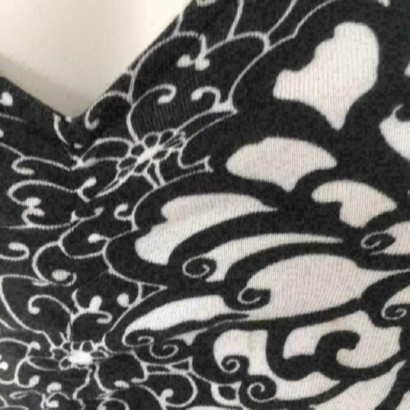 3220 Elegante zwart/witte jurk BROOKER; Mt= 38 Nieuwstaat"