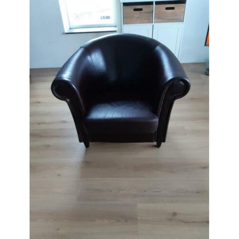 Leren bruine fauteuil.