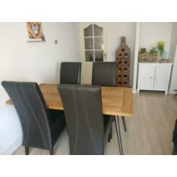 4 zwarte leren eetkamerstoelen
