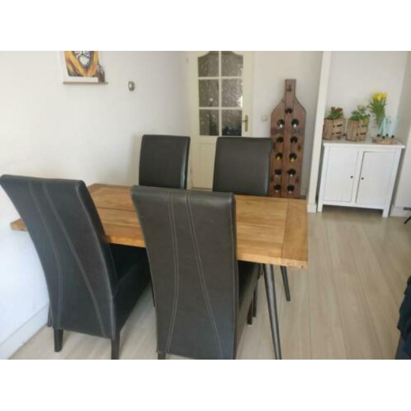 4 zwarte leren eetkamerstoelen